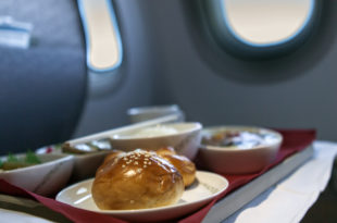 food on a tray on a plane