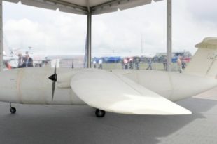 a white airplane in a tent