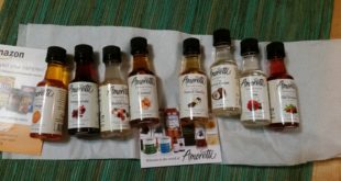a row of small bottles with different colored liquids