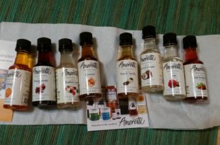 a row of small bottles with different colored liquids