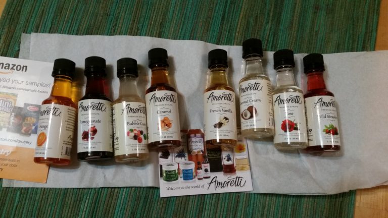 a row of small bottles with different colored liquids