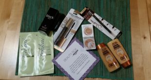a group of makeup products on a green mat