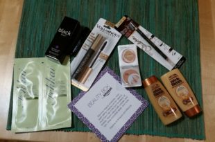 a group of makeup products on a green mat