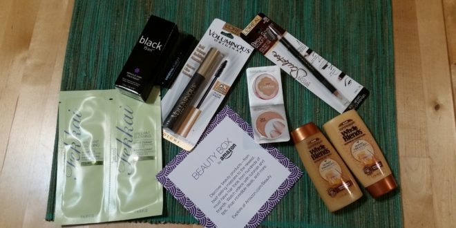 a group of makeup products on a green mat
