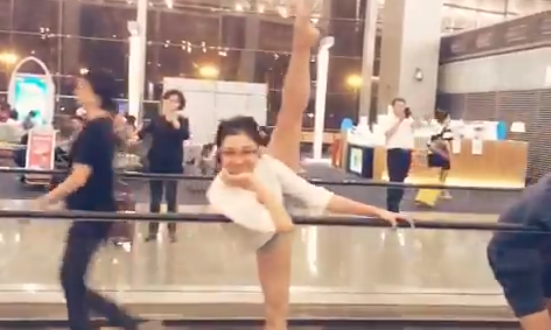 a woman in a white leotard