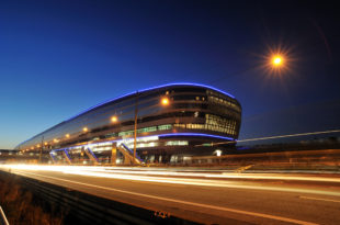 a building with lights on the side of it