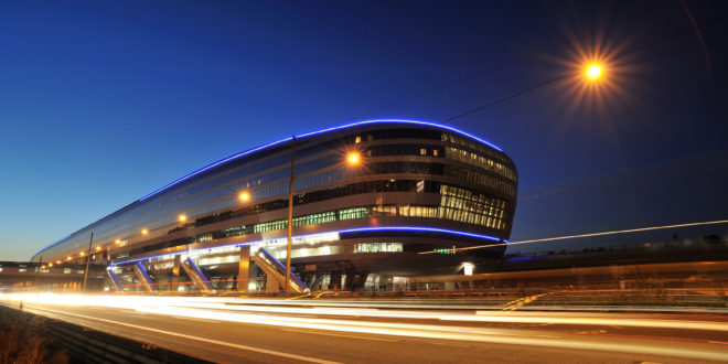 a building with lights on the side of it