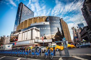 a group of bicycles parked in front of a building