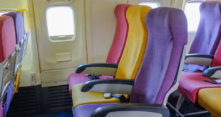 a row of colorful seats in an airplane