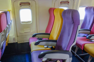 a row of colorful seats in an airplane