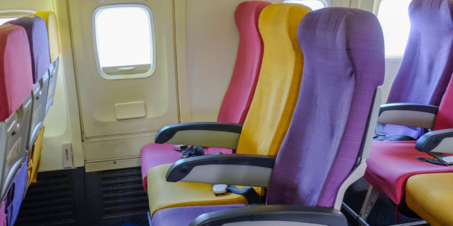 a row of colorful seats in an airplane