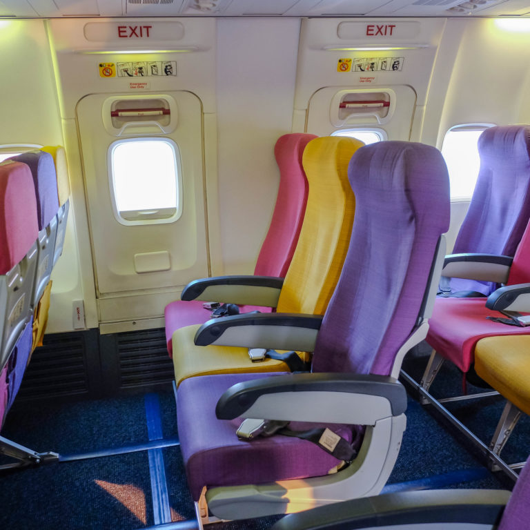 a row of colorful seats in an airplane