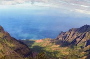 a mountain range with a body of water