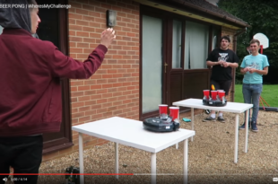 a man taking a selfie with a table with cups on it