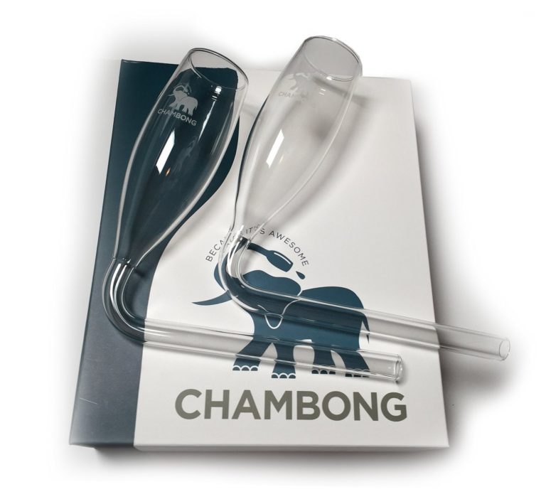 a pair of champagne glasses on a book