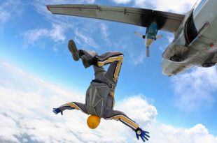 a person in a suit falling off of an airplane