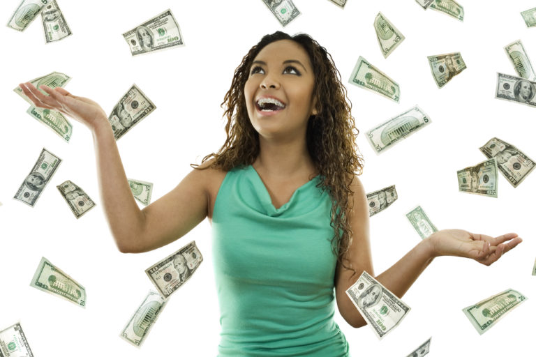 a woman throwing money in the air