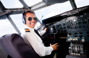 a man in a pilot's cockpit