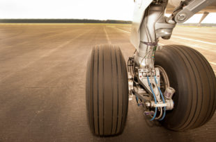 a close up of a plane's wheels