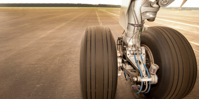 a close up of a plane's wheels