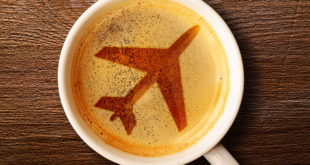 a coffee cup with a picture of a plane on the foam