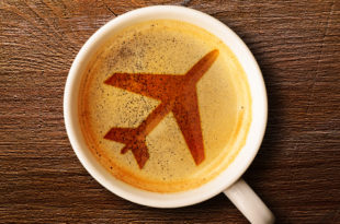 a coffee cup with a picture of a plane on the foam