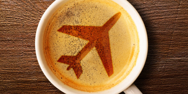 a coffee cup with a picture of a plane on the foam