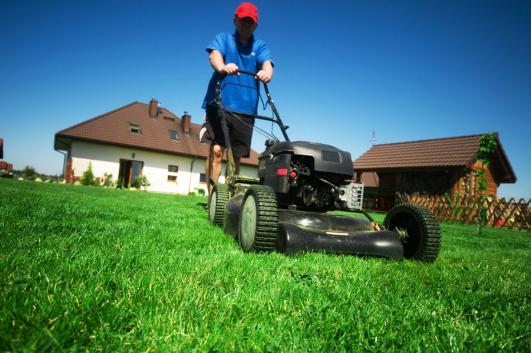 a man mowing the grass