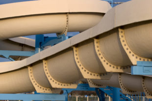 a water slide with blue posts