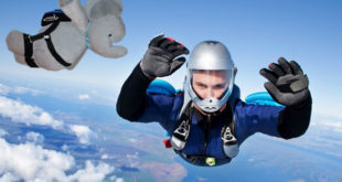 a person skydiving with a stuffed elephant