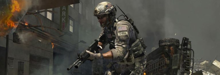 a man in military uniform holding a gun