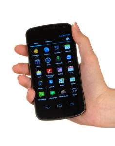 a hand holding a cell phone