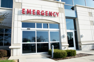 a emergency room with glass doors