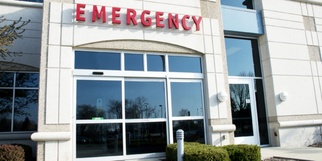 a emergency room with glass doors