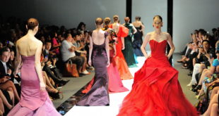 a group of women in dresses on a runway