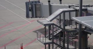 an airport with stairs and a walkway