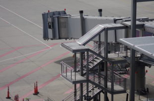 an airport with stairs and a walkway