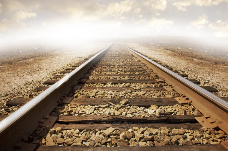 a train tracks in a desert