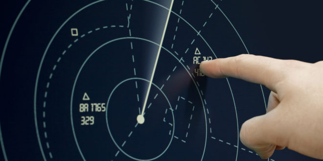 a finger touching a screen