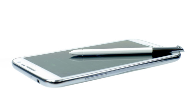 a white stylus on a cell phone