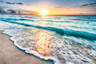 a sunset over a beach