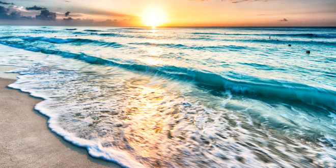 a sunset over a beach