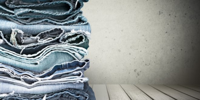a stack of jeans on a table