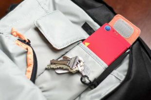 a red rectangular object with keys in a pocket