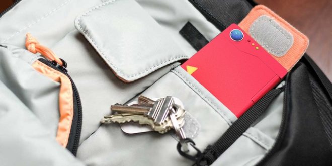 a red rectangular object with keys in a pocket