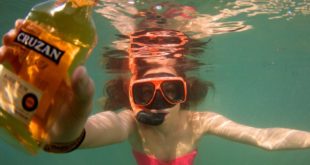 a woman in a garment and goggles underwater