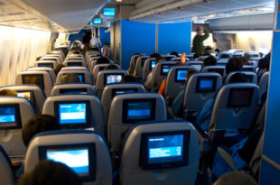 a group of people sitting in an airplane