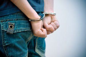 a person in handcuffs on their hands
