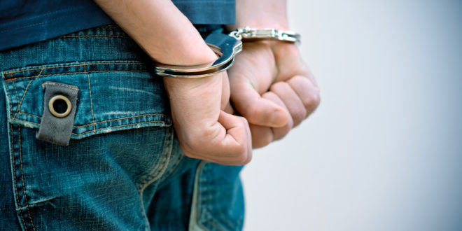 a person in handcuffs on their hands