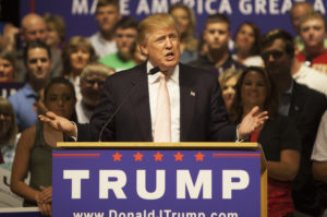 a man speaking at a podium